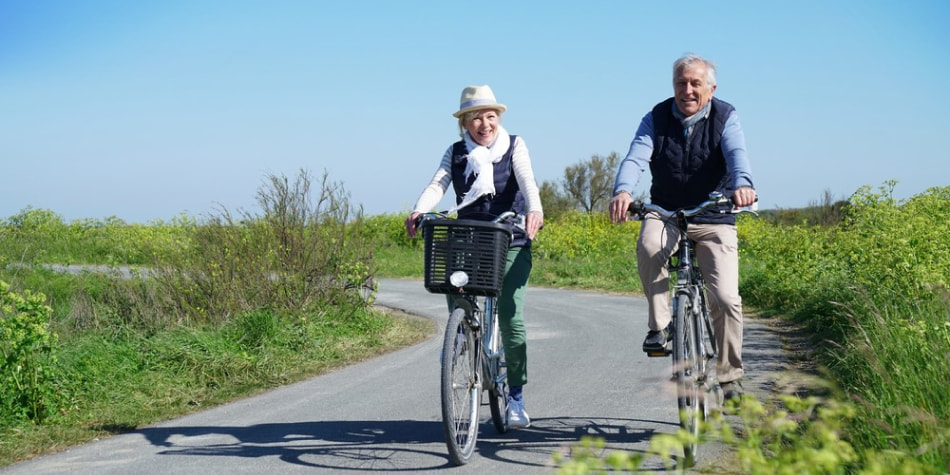 Senior couple riding bikes